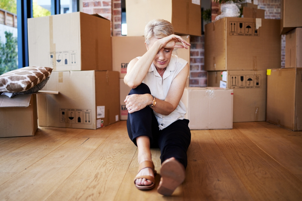 Mature,Woman,,Tired,And,Boxes,In,New,Home,,Burnout,And